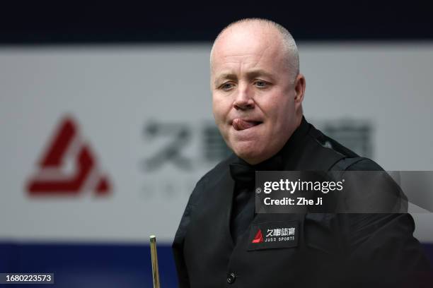 John Higgins of Scotland reacts in the quarter-final match against Ronnie O'Sullivan of England on Day 4 of World Snooker Shanghai Masters 2023 at...