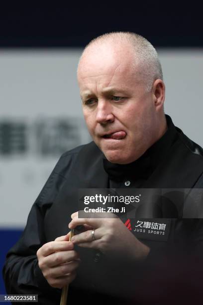 John Higgins of Scotland reacts in the quarter-final match against Ronnie O'Sullivan of England on Day 4 of World Snooker Shanghai Masters 2023 at...