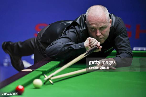 John Higgins of Scotland plays a shot in the quarter-final match against Ronnie O'Sullivan of England on Day 4 of World Snooker Shanghai Masters 2023...