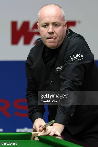 John Higgins of Scotland reacts in the quarter-final match against Ronnie O'Sullivan of England on Day 4 of World Snooker Shanghai Masters 2023 at...