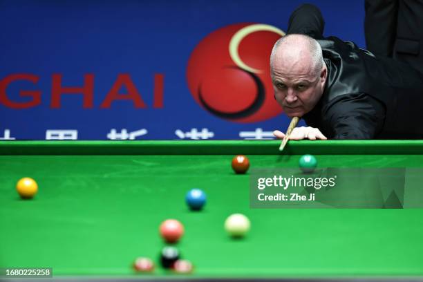 John Higgins of Scotland plays a shot in the quarter-final match against Ronnie O'Sullivan of England on Day 4 of World Snooker Shanghai Masters 2023...