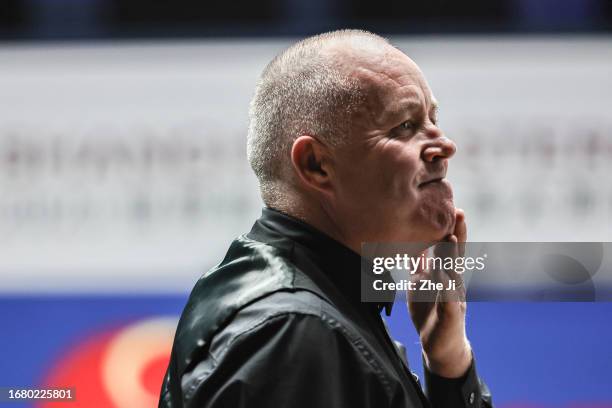 John Higgins of Scotland reacts in the quarter-final match against Ronnie O'Sullivan of England on Day 4 of World Snooker Shanghai Masters 2023 at...