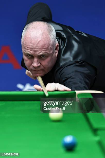 John Higgins of Scotland plays a shot in the quarter-final match against Ronnie O'Sullivan of England on Day 4 of World Snooker Shanghai Masters 2023...