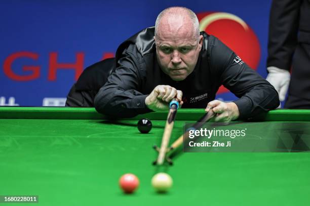 John Higgins of Scotland plays a shot in the quarter-final match against Ronnie O'Sullivan of England on Day 4 of World Snooker Shanghai Masters 2023...