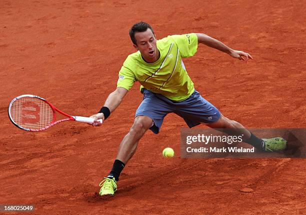 Philipp Kohlschreiber of Germany plays a forehand against Daniel Brands of Germany during the semi final of the BMW Open at Iphitos tennis club on...