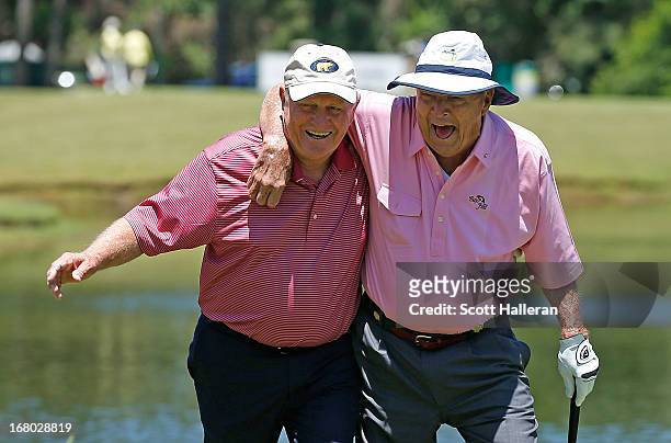 Jack Nicklaus and Arnold Palmer walk to the third green during the Greats of Golf exhibition at the Insperity Championship at the Woodlands Country...