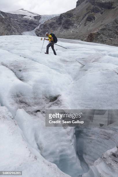 Andreas Kellerer-Pirklbauer-Eulenstein, a geographer at the University of Graz, walks across the tongue of the Pasterze glacier during annual data...