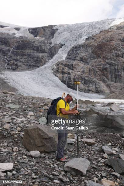 Andreas Kellerer-Pirklbauer-Eulenstein, a geographer at the University of Graz, takes a GPS reading on a rock and gravel-covered portion of the...