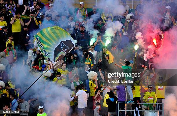 Anzhi Makhachkala fans light flares during the Russian Premier League match between FC Anzhi Makhachkala and FC Rubin Kazan at the Anzhi Arena...