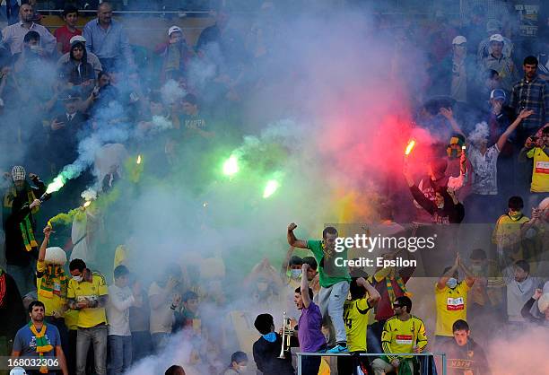 Anzhi Makhachkala fans light flares during the Russian Premier League match between FC Anzhi Makhachkala and FC Rubin Kazan at the Anzhi Arena...