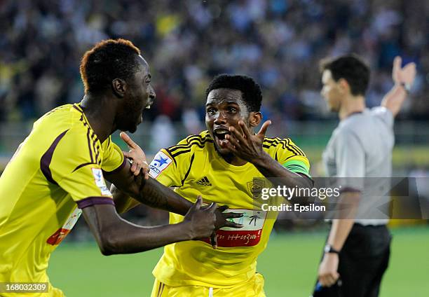 Lacina Traore FC Anzhi Makhachkala celebrates with team-mate Samuel Eto'o after scoring a goal during the Russian Premier League match between FC...