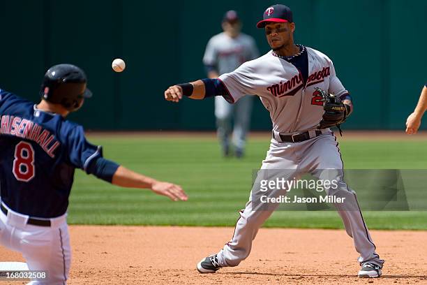 Lonnie Chisenhall is out at second as shortstop Pedro Florimon throws to first for the double play to end the sixth inning at Progressive Field on...