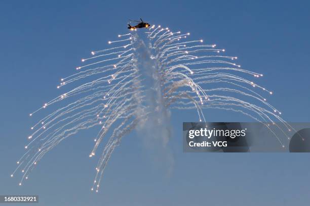 An armed helicopter performs during the 6th China Helicopter Exposition at the Industry Base of the AVIC Helicopter on September 14, 2023 in Tianjin,...