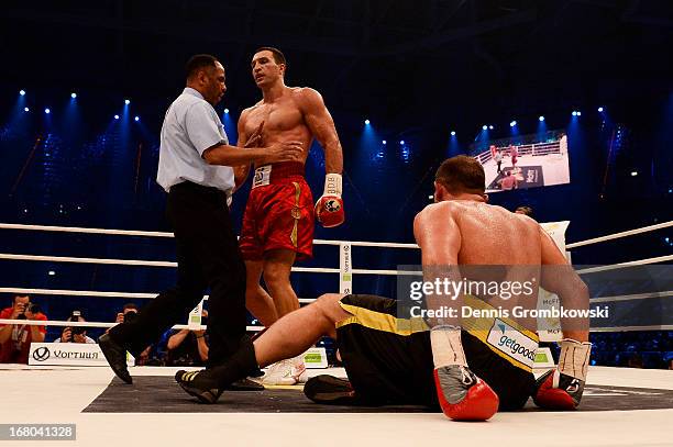 Referee Ernest Sharif steps in after Wladimir Klitschko of Ukraine knocked Francesco Pianeta down during their IBF, IBO, WBA, WBO World Championship...