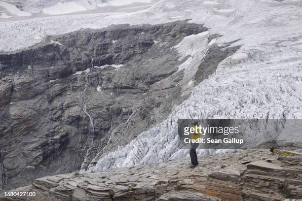 Andreas Kellerer-Pirklbauer-Eulenstein, a geographer at the University of Graz, takes a photo on the upper surface of the Pasterze glacier during...