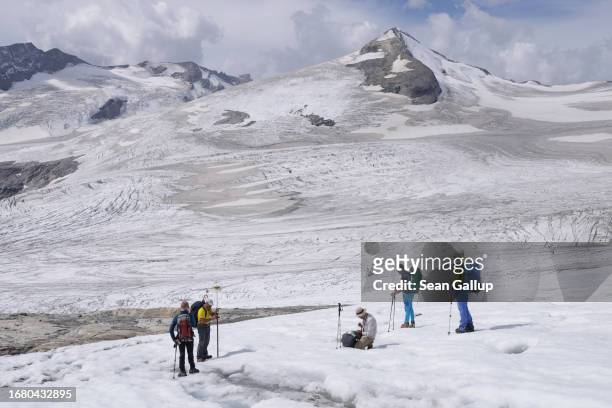 Scientists from the University of Graz record data on the plateau of the Pasterze glacier on September 12, 2023 near Heiligenblut, Austria. The...