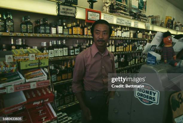 Nguyen Cao Ky , former Prime Minister of South Vietnam, working in his liquor store in Los Angeles, California, July 6th 1977.