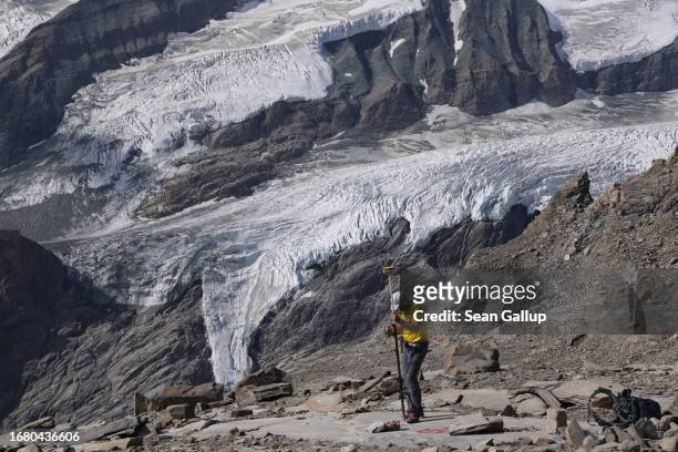 Andreas Kellerer-Pirklbauer-Eulenstein, a geographer at the University of Graz, records a GPS reading as ice descends from the plateau of the...