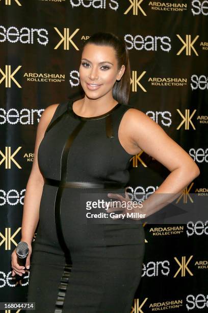 Kim Kardashian poses on the red carpet at Sears to promote the "Spring 2013 Kardashian Kollection" on May 4, 2013 in Houston, Texas.