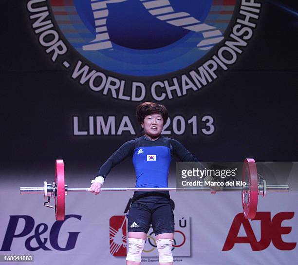 Seul-Ki Lee of Korea A competes in the Women's 48kg snatch during day one of the 2013 Junior Weightlifting World Championship at Maria Angola...