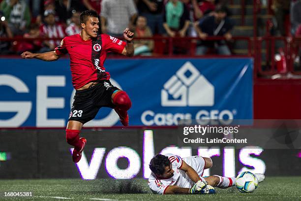 Luis Michel of Chivas fights for the ball with Richard Ruiz of Xolos during a match between Xolos and Chivas as part of the Torneo Clausura 2013 Liga...