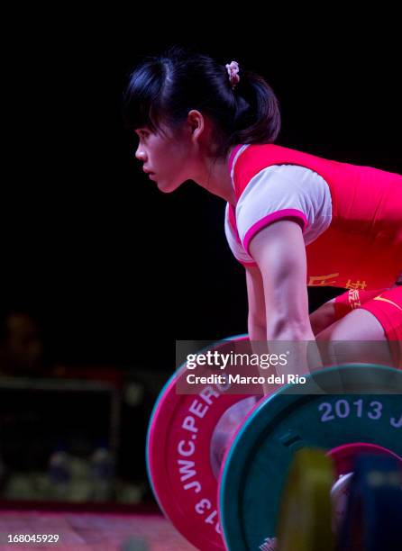 Chunying Guan of China A competes in the Women's 48kg clean and jerk during day one of the 2013 Junior Weightlifting World Championship at Maria...