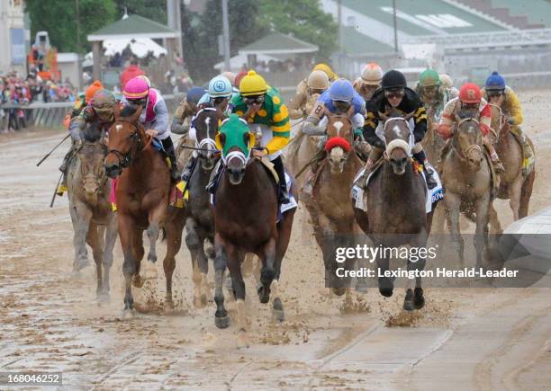 Palace Malice, with Mike Smith up, had the lead as the pack ran down the backstretch approaching the 3rd turn during the 139th running of the...