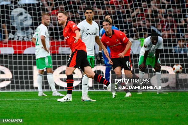 Rennes' French defender Adrien Truffert celebrates scoring his team's second goal during the Europa League Group F football match between Stades...