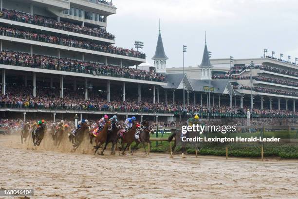 Palace Malice, with Mike Smith up, leads during the first turn of the 139th running of the Kentucky Derby at Churchill Downs in Louisville, Kentucky,...