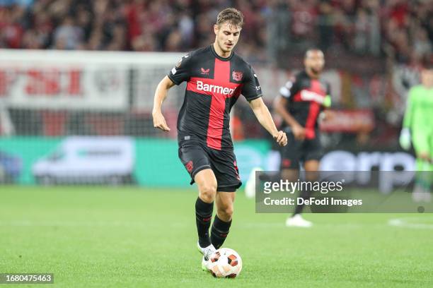 Josip Stanisic of Bayer 04 Leverkusen controls the ball during the UEFA Europa League 2023/24 group stage match between Bayer 04 Leverkusen and BK...