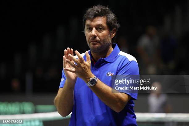 Sebastian Grosjean, team captain of France applauds during the Davis Cup Finals Group Stage match between France and Australia at AO Arena on...