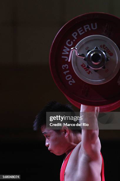 Xiameng Wei of China A competes in the Men's 56kg during day one of the 2013 Junior Weightlifting World Championship at Maria Angola Convention...