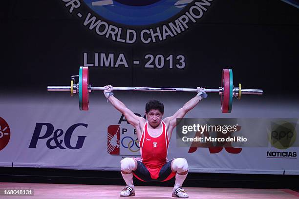 Marco Antonio Rojas of Peru A competes in the Men's 56kg during day one of the 2013 Junior Weightlifting World Championship at Maria Angola...