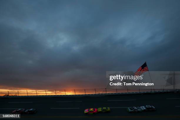 Regan Smith, driver of the TaxSlayer.com Chevrolet, leads the field during the NASCAR Nationwide Series Aaron's 312 at Talladega Superspeedway on May...