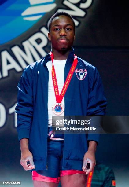 Darren barnes of US A receives a Bronze medal in the Men's 56kg during day one of the 2013 Junior Weightlifting World Championship at Maria Angola...