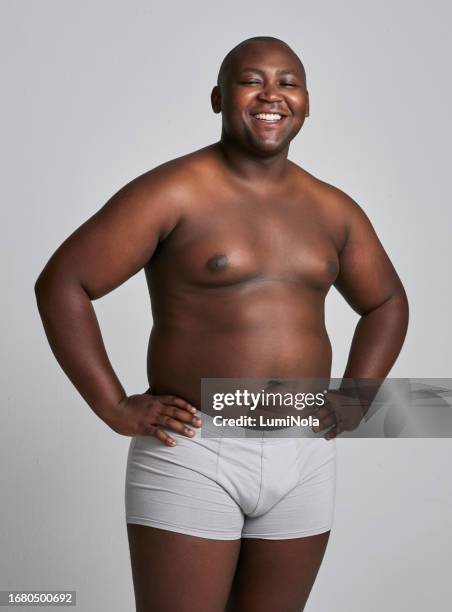 man in portrait, plus size and body positivity with health, fitness and underwear, inclusion isolated on white background . shirtless, happy with confidence and african model with wellness in studio - plus size model male stock pictures, royalty-free photos & images