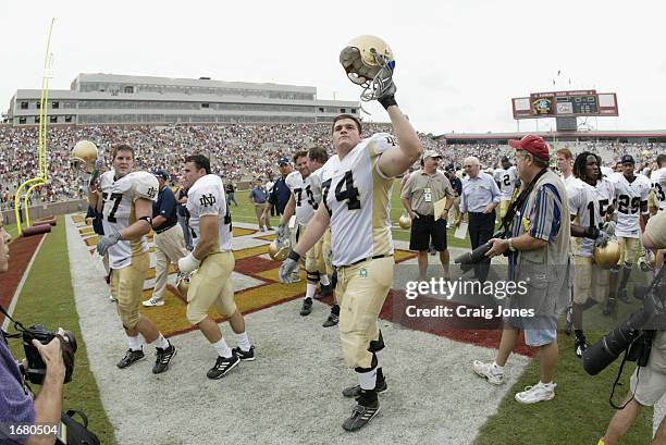 Notre Dame guard Dan Stevenson salutes the crowd in victory as his team leaves the field after defeating FSU in the NCAA football game at Doak...