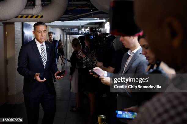 Rep. Darrell Issa talks to reporters following a Republican caucus meeting in the basement of the U.S. Capitol on September 14, 2023 in Washington,...