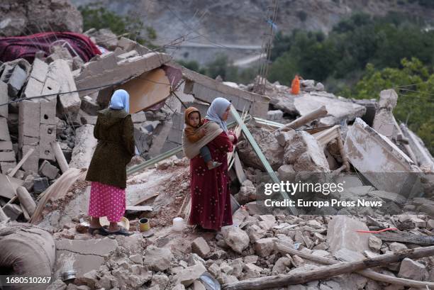 Women search through the rubble of a village that disappeared on September 14 in Imi N'Tala, in the Marrakech-Safi region of Morocco. In this...