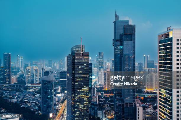 jakarta business district at dusk, indonesia - jakarta stock pictures, royalty-free photos & images