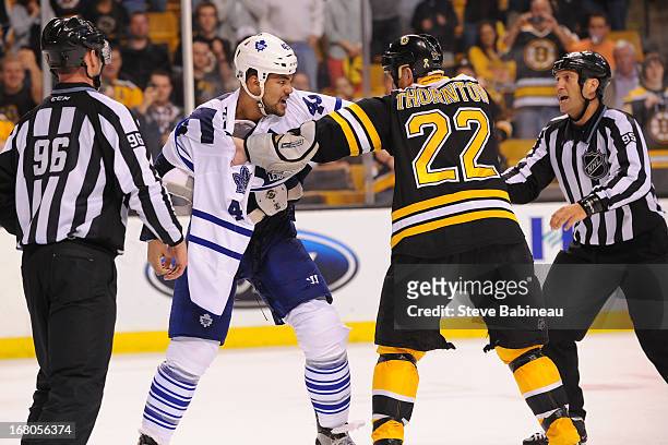 Mark Fraser of the Toronto Maple Leafs fights against Shawn Thornton of the Boston Bruins in Game Two of the Eastern Conference Quarterfinals during...
