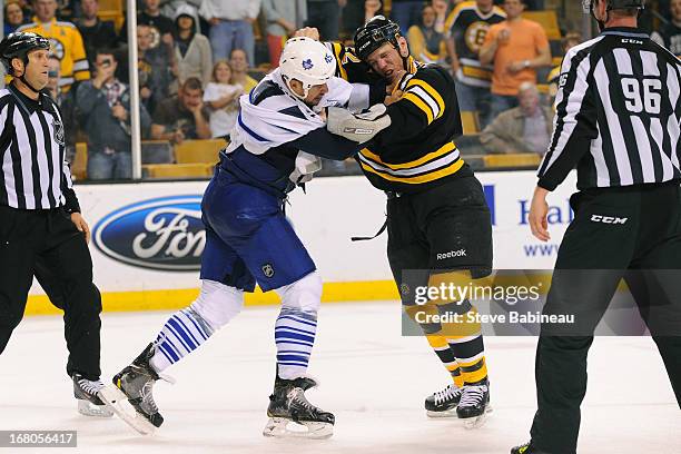Shawn Thornton of the Boston Bruins fights against Mark Fraser of the Toronto Maple Leafs in Game Two of the Eastern Conference Quarterfinals during...