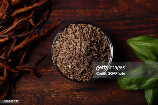 cumin seeds with basil and seaweed - cumin stock pictures, royalty-free photos & images