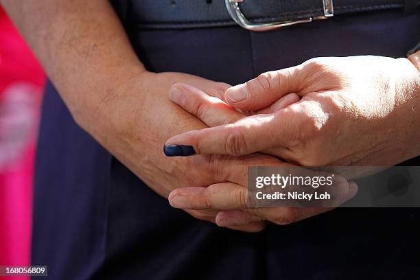 Closeup of the hands of Malaysia's Prime Minister and Barisan Nasional chairman Najib Razak at a polling station during election day on May 5, 2013...