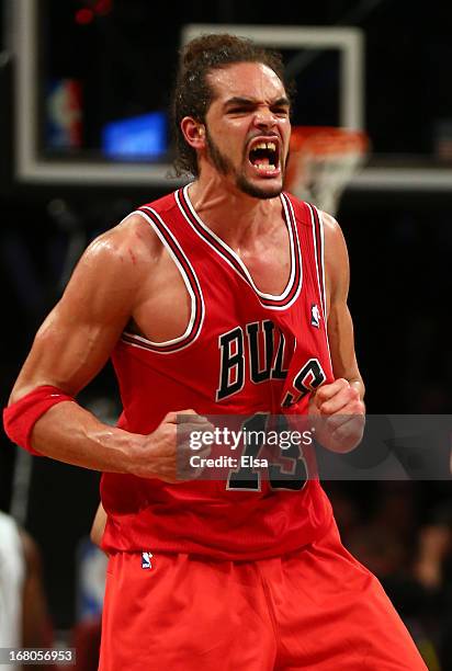Joakim Noah of the Chicago Bulls celebrates the win over the Brooklyn Nets after Game Seven of the Eastern Conference Quarterfinals of the 2013 NBA...