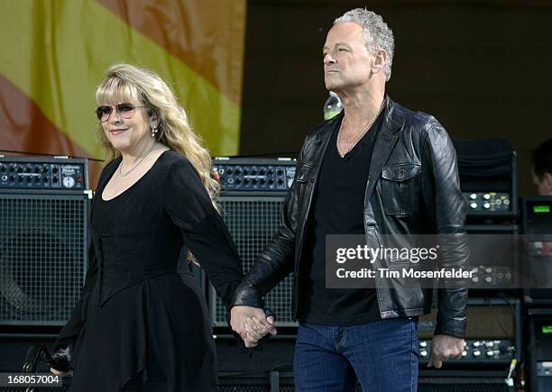 Stevie Nicks and Lindsey Buckingham of Fleetwood Mac take the stage at the 2013 New Orleans Jazz & Heritage Festival at Fair Grounds Race Course on...