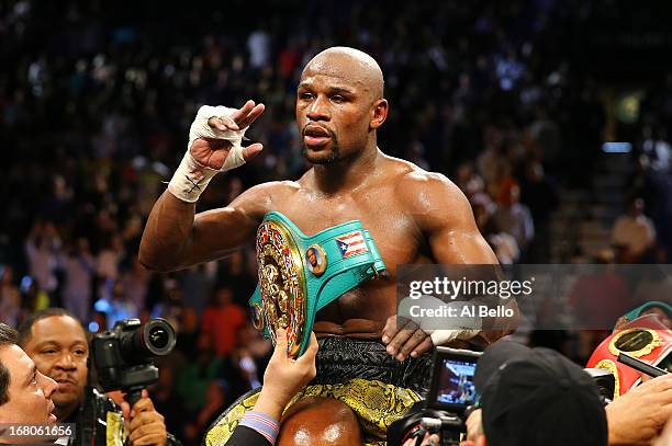Floyd Mayweather Jr. Celebrates his unanimous-decision victory over Robert Guerrero in their WBC welterweight title bout at the MGM Grand Garden...