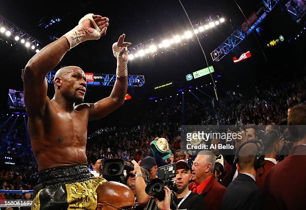 Floyd Mayweather Jr. Celebrates his unanimous-decision victory over Robert Guerrero in their WBC welterweight title bout at the MGM Grand Garden...