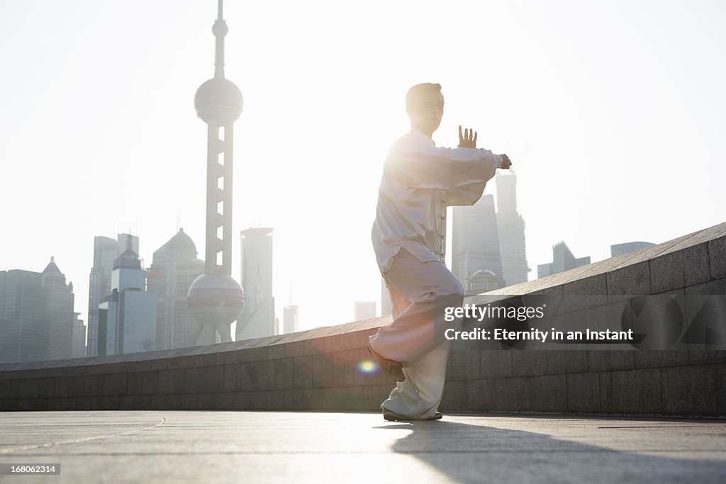 Chinese man practicing Tai Chi in Shanghai