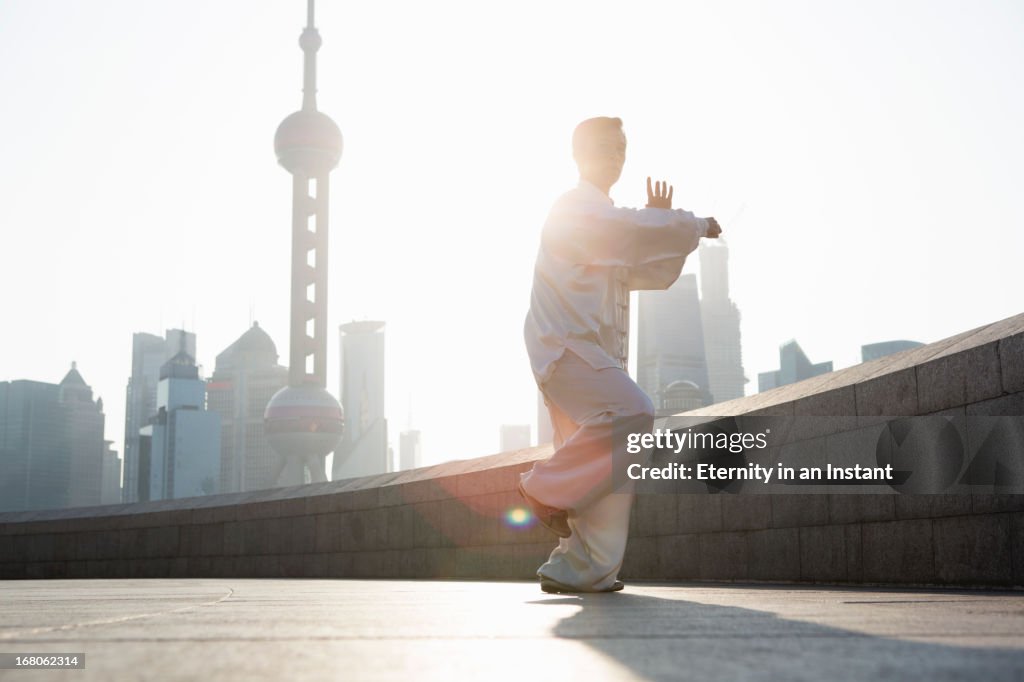 Chinese man practicing Tai Chi in Shanghai